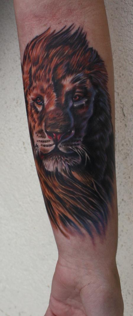 Ty McEwen - lion tattoo